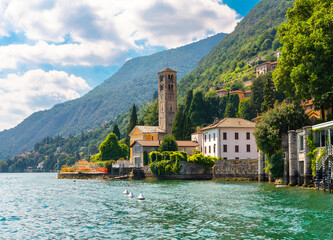 Italy, Lake Como. View of the old church and villas from the lake