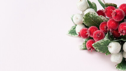 art and craft equipment on a pale pink background, invitation mockup, red berries in sugar, christmas decoration