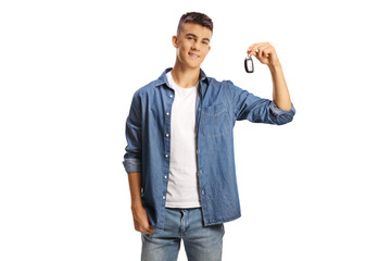 Male teenage guy holding a car key and smiling