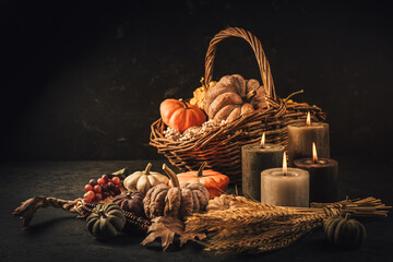 Pumpkins on wooden table - Thanksgiving, fall themed holiday table setting arrangement for a...