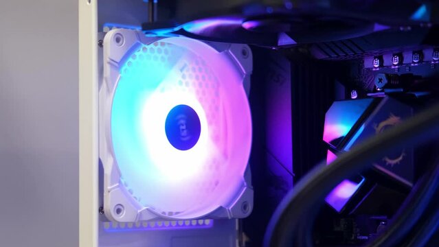 The fan rotates slowly in the case. An integral part of a computer, a spinning fan. Cooling system. Computer equipment, part, assembly and repair, IT.