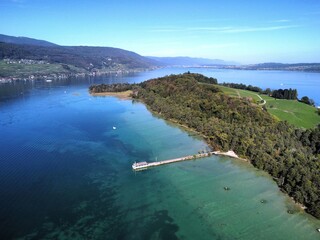Aerial view of the shore of the St. Peter's Island and its berth at the lake Biel,  Switzerland - obrazy, fototapety, plakaty