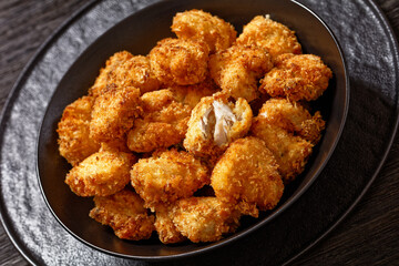 crispy fried panko breaded chicken bites in bowl