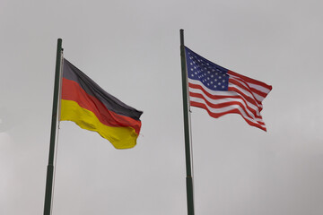 USA and Germany Flags on the flagpoles.