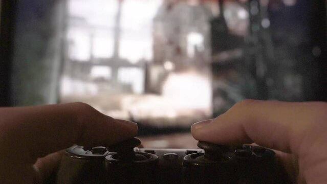 First Person Shooter, FPS Video Game Playing on Playstation Console, Shooting Machine Gun in an Open World War Game