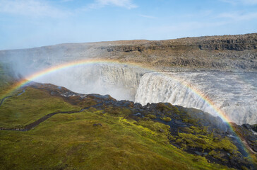 Fototapeta na wymiar A Rainbow at Iceland's Hafragilsfoss Waterfall in Vatnajokull National Park