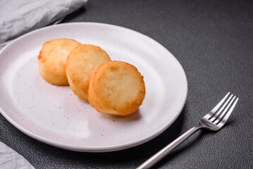 Delicious fresh sweet cheese pancakes with raisins and cinnamon