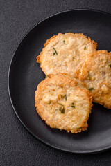 Delicious fried minced fish cutlets or meatballs with salt, spices and herbs