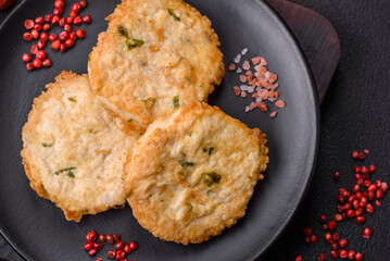 Delicious fried minced fish cutlets or meatballs with salt, spices and herbs