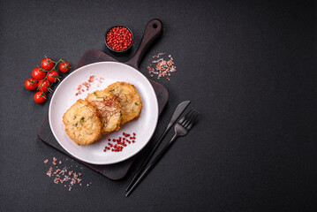 Delicious fried minced fish cutlets or meatballs with salt, spices and herbs