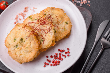 Delicious fried minced fish cutlets or meatballs with salt, spices and herbs