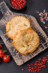 Delicious fried minced fish cutlets or meatballs with salt, spices and herbs