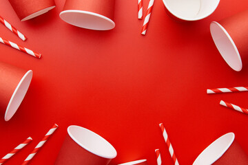 Paper cups on a red background. Eco friendly, sustainable lifestyle.