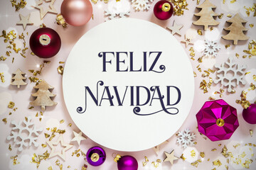 Fototapeta na wymiar Text Feliz Navidad, Means Merry Christmas, Purple Flatlay Christmas Decor