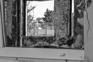 broken windows in a burned-out school during hostilities in the city of Kharkiv