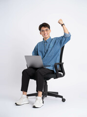 Full body of young Asian man using laptop on white background