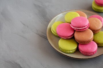 Colorful Homemade French Macarons on a Plate, side view. Space for text.