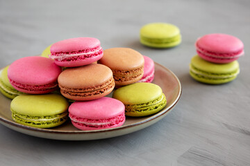 Fototapeta na wymiar Colorful Homemade French Macarons on a Plate, low angle view.