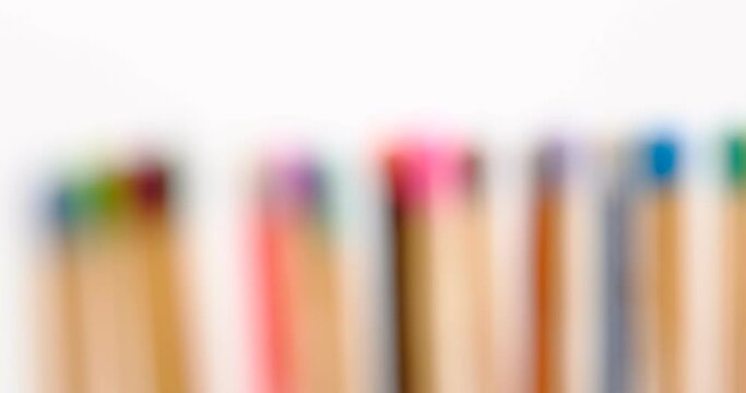 Still shot of colored matchsticks, with shallow depth of field and focus transition