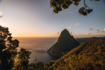 Pitons on Santa Lucia, La Souffriere bay during sunset with blue sky and cotton candy clouds....