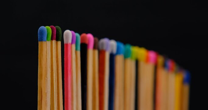 Still shot of colored matchsticks, with shallow depth of field and focus transition