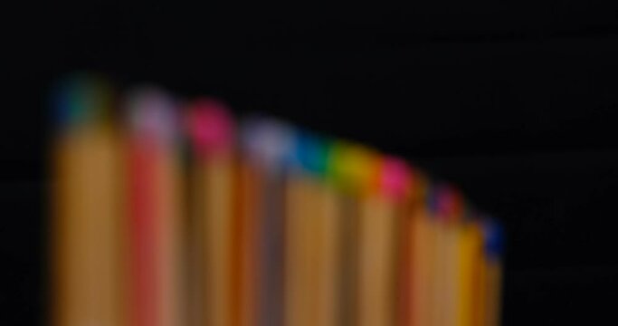 Still shot of colored matchsticks, with shallow depth of field and focus transition