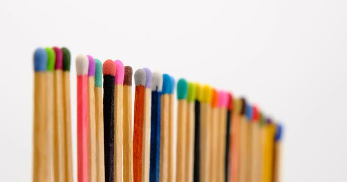 Still shot of colored matchsticks, with shallow depth of field and focus transition