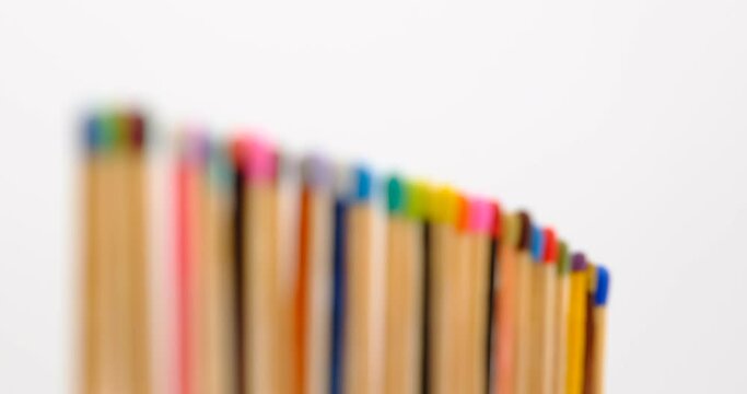 Still shot of colored matchsticks, with shallow depth of field and focus transition