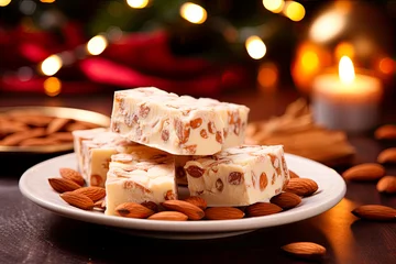 Foto op Canvas Traditional christmas nougat with almonds on christmas decorated background © chandlervid85