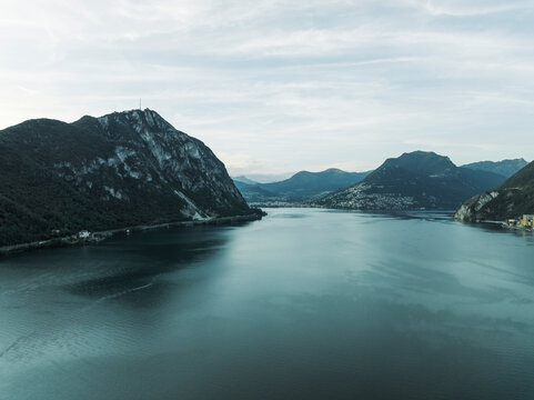 Aerial view of Lugano lake at sunset and Mount San Giorgio, Melide, Ticino, Switzerland.