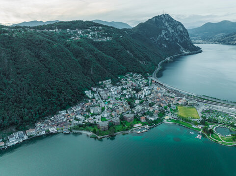Aerial view of Melide, a small town along the Lugano Lake at sunset in Ticino, Switzerland.