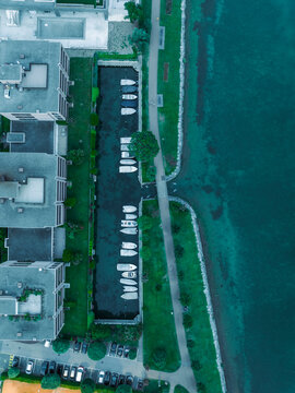 Aerial view of boats moored in a small harbour in Melide along the Lugano Lake, Ticino, Switzerland.