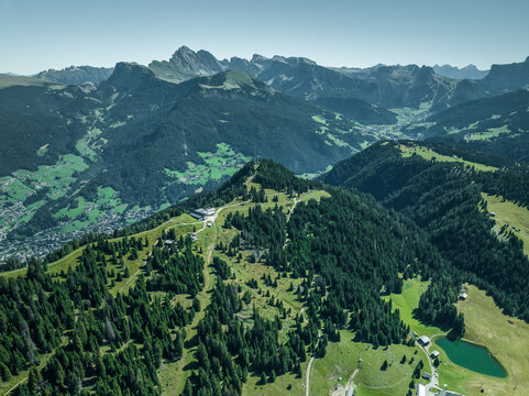 Aerial view of the mountain ridge at the top of Alpe di Siusi (Seiser Alm) on the Dolomites mountains with Secede peak in background, Ortisei, Trentino, South Tyrol in Northern Italy.