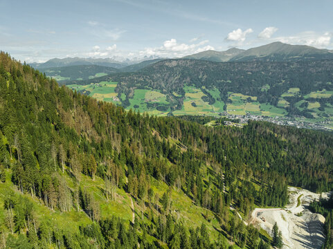 Aerial view of San Candido town as seen from Croda dei Baranci (Birkenkofel) mountain peak on the Dolomites range, Innichen, Trentino, South Tyrol, Italy.