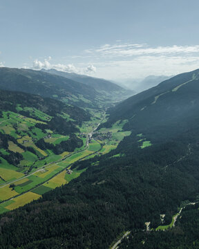 Aerial view of Versciaco town as seen from Croda dei Baranci (Birkenkofel) mountain peak on the Dolomites range, Trentino, South Tyrol, Italy.