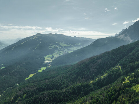 Aerial view of Versciaco town as seen from Croda dei Baranci (Birkenkofel) mountain peak on the Dolomites range, Trentino, South Tyrol, Italy.