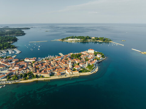 Aerial view of Porec and Otocic Sveti Nikola, a small island, a small town along the Adriatic Sea coastline in Istria, Croatia.