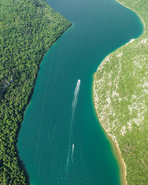 Aerial view of boats sailing along the Limski Fjord (Canal di Leme) in Sveti Lovrec, Istria, Croatia.