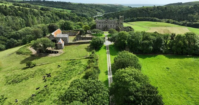 An old-world castle set against a picturesque rural landscape in Ireland 4k