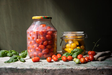 red and yellow cherry tomatoes in a jar for winter