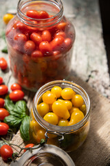 red and yellow cherry tomatoes in a jar for winter