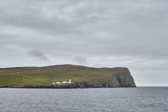 Lighthouse and buildings on the island of Bressay in the Shetland islands in Scotland.