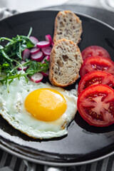 fried egg tasty breakfast fresh vegetables and toasted bread healthy eating cooking appetizer meal food snack on the table copy space