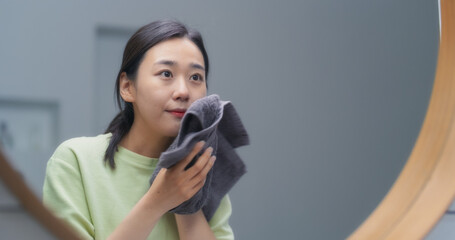 Beautiful South Korean Female Washing Her Face in a Bathroom at Home. Young Woman Enjoying Her Morning Beauty Routine, Freshing Up After a Night's Sleep, Drying Up Her Skin with a Soft Towel