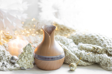 Christmas still life with an aroma diffuser for moisturizing the air, copy space.