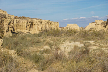 Desert landscape of the arid plateau of the Bardenas Reales at dry out river bed Barranco Grande,...