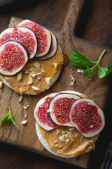 Whole grain bread with peanut butter and fresh figs