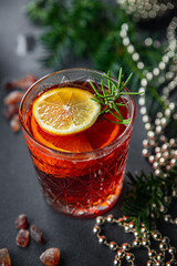 christmas mulled wine cocktail citrus and rosemary traditional drink new year holiday appetizer meal food snack on the table