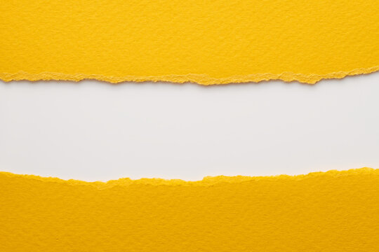 Art collage of pieces of ripped paper with torn edges. Sticky notes collection yellow white colors, shreds of notebook pages. Abstract background.