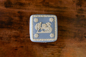 wedding rings in a box, jewelry box on a wooden background, blue box, blue antique porcelain box,...